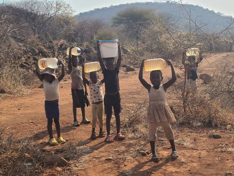 Children carrying water